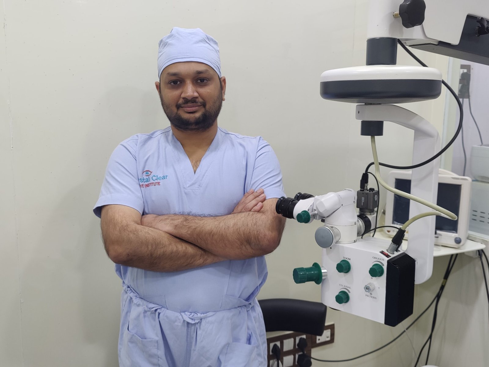 Dr. Jignesh Gala retina surgeon in operation theatre scrubs beside surgical microscope — intravitreal injection expert Andheri West